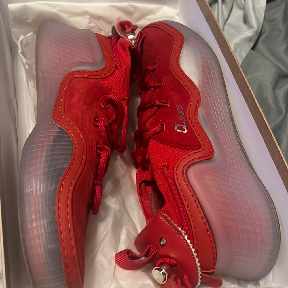 Christian louboutine  gym shoe low top sneaker aka red bottoms